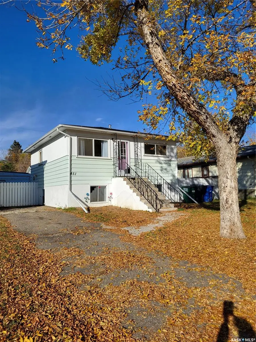 Exterior photo of 451 Avenue S South, Saskatoon SK — updated raised bungalow with double garage and large lot.